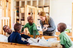 Fundraiser daughter plays with kids recovering from surgery in Tanzania